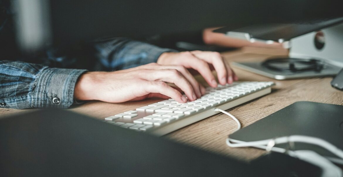 person using computer keyboard
